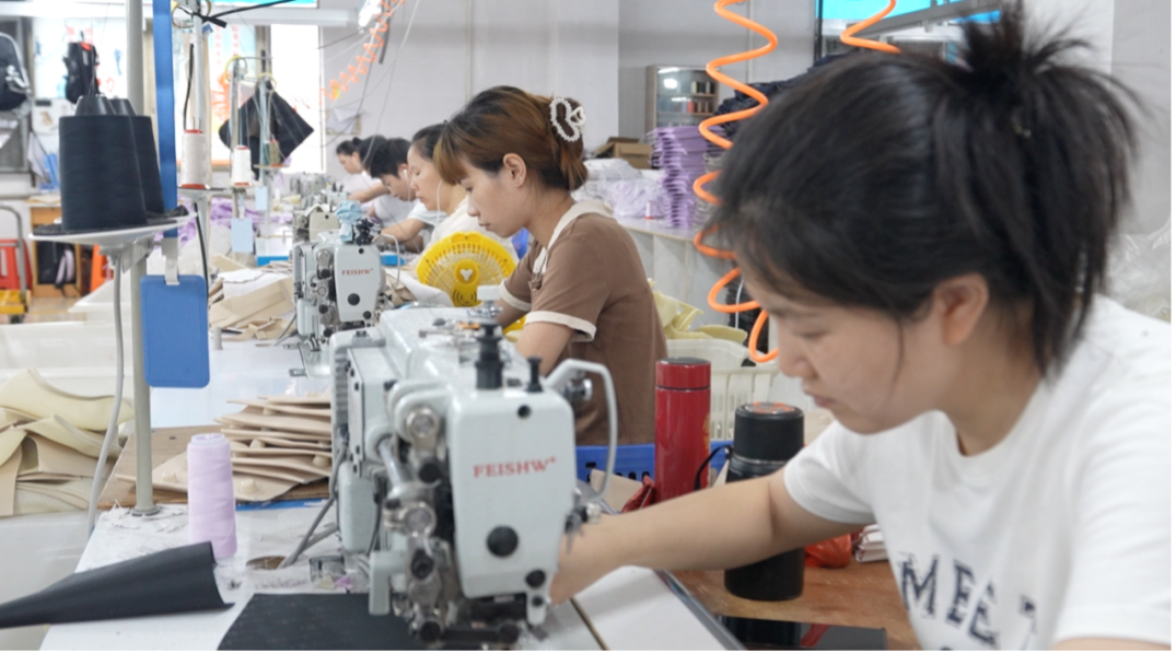 Employees working at the factory of Kobe Leather, in Guangzhou City, Guangdong Province, May 22, 2025. /CGTN