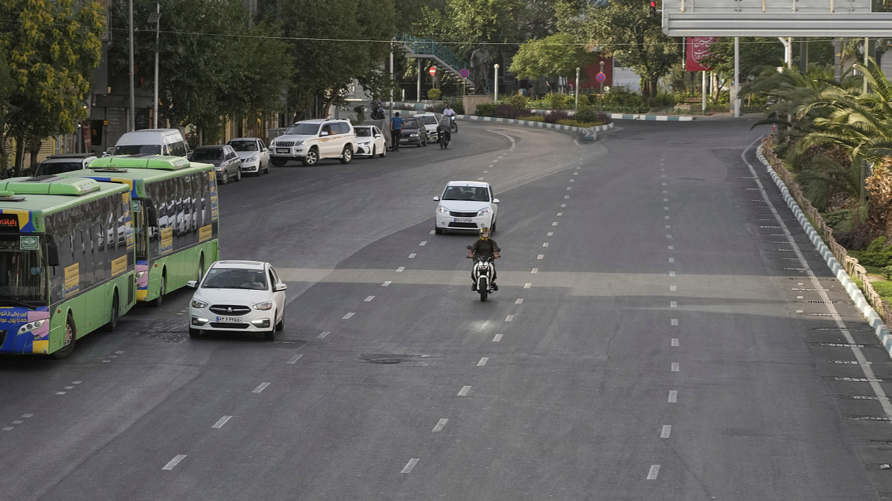 Vehicles drive in a quiet square in downtown Tehran, Iran, Monday, June 23, 2025. /CFP
