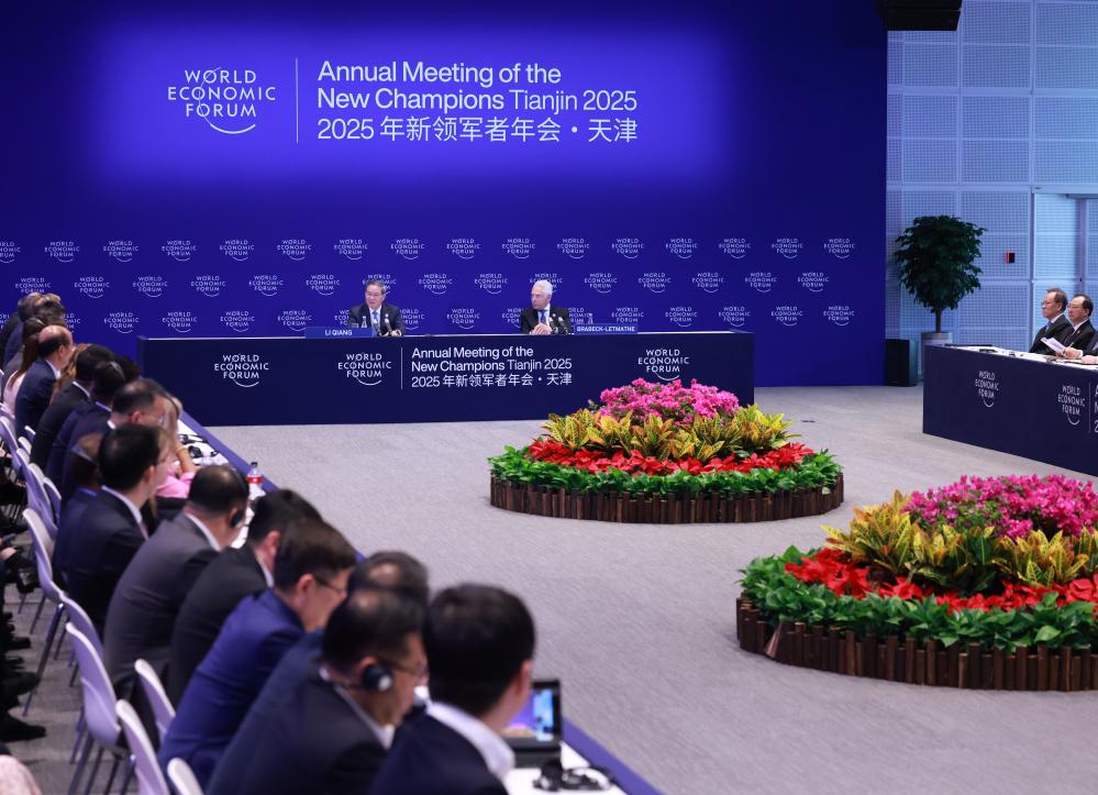 Chinese Premier Li Qiang attends a symposium and exchanges ideas with business representatives at the 16th Annual Meeting of the New Champions, also known as the Summer Davos, in north China's Tianjin Municipality, June 25, 2025. /Xinhua