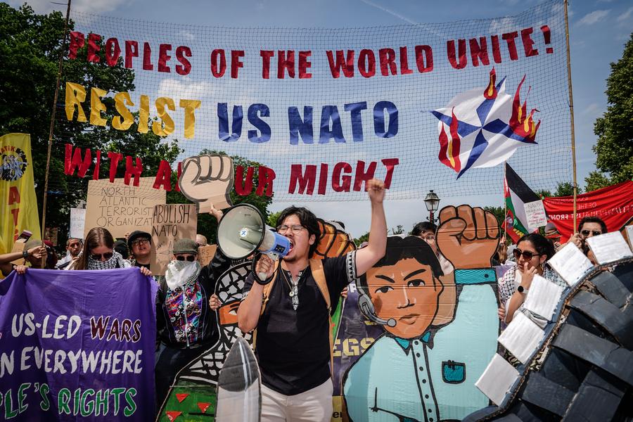 Protesters holding banners and placards are pictured in The Hague, the Netherlands, June 22, 2025. /Xinhua