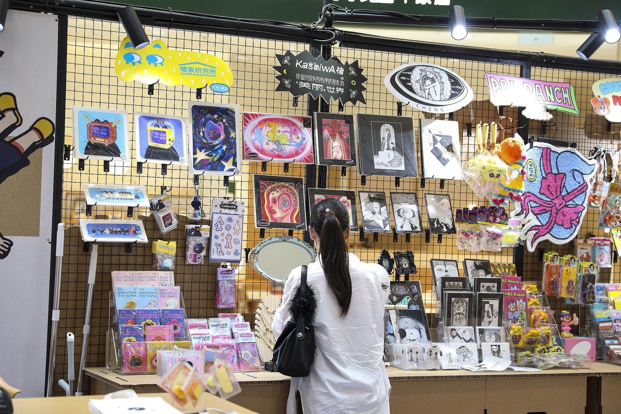 Consumer looking at animation peripheral products in Shanghai, China, June 26, 2025. /VCG