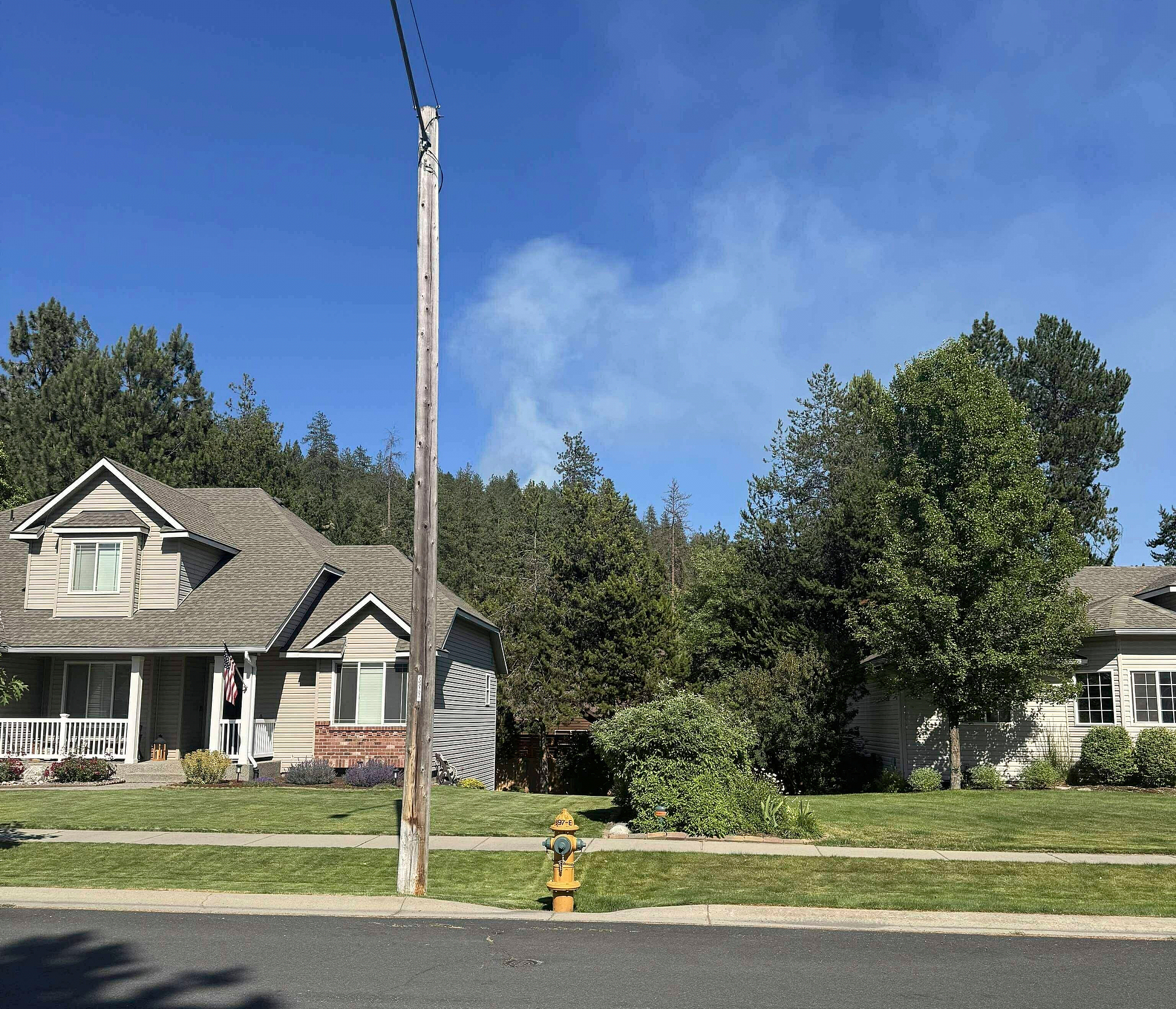 In this photo provided by Mark Lathrop, a blaze burns in a community near Canfield Mountain, just north of Coeur d'Alene, where a sniper ambushed firefighters responding to the fire, Idaho, June 29, 2025. /VCG