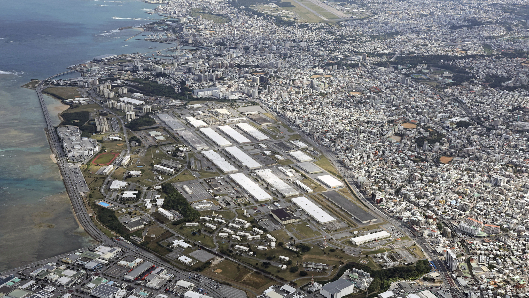 From left, an aerial photo shows the United States Forces Japan's Makiminato Service Area and Air Station Futenma in Okinawa Prefecture, December 29, 2024. /VCG