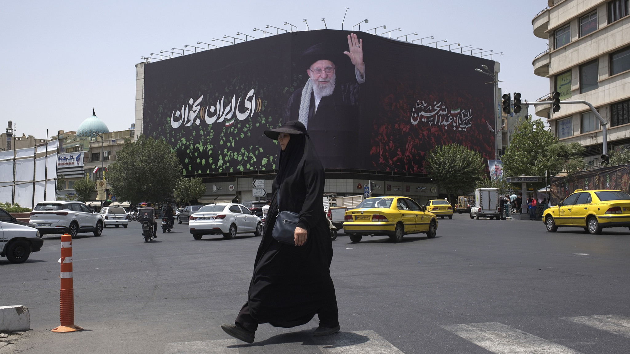 A giant billboard featuring a portrait of Iran's Supreme Leader, Ayatollah Ali Khamenei, and a Persian script that reads, Sing, Oh Iran, in downtown Tehran, Iran, on July 8, 2025. /VCG