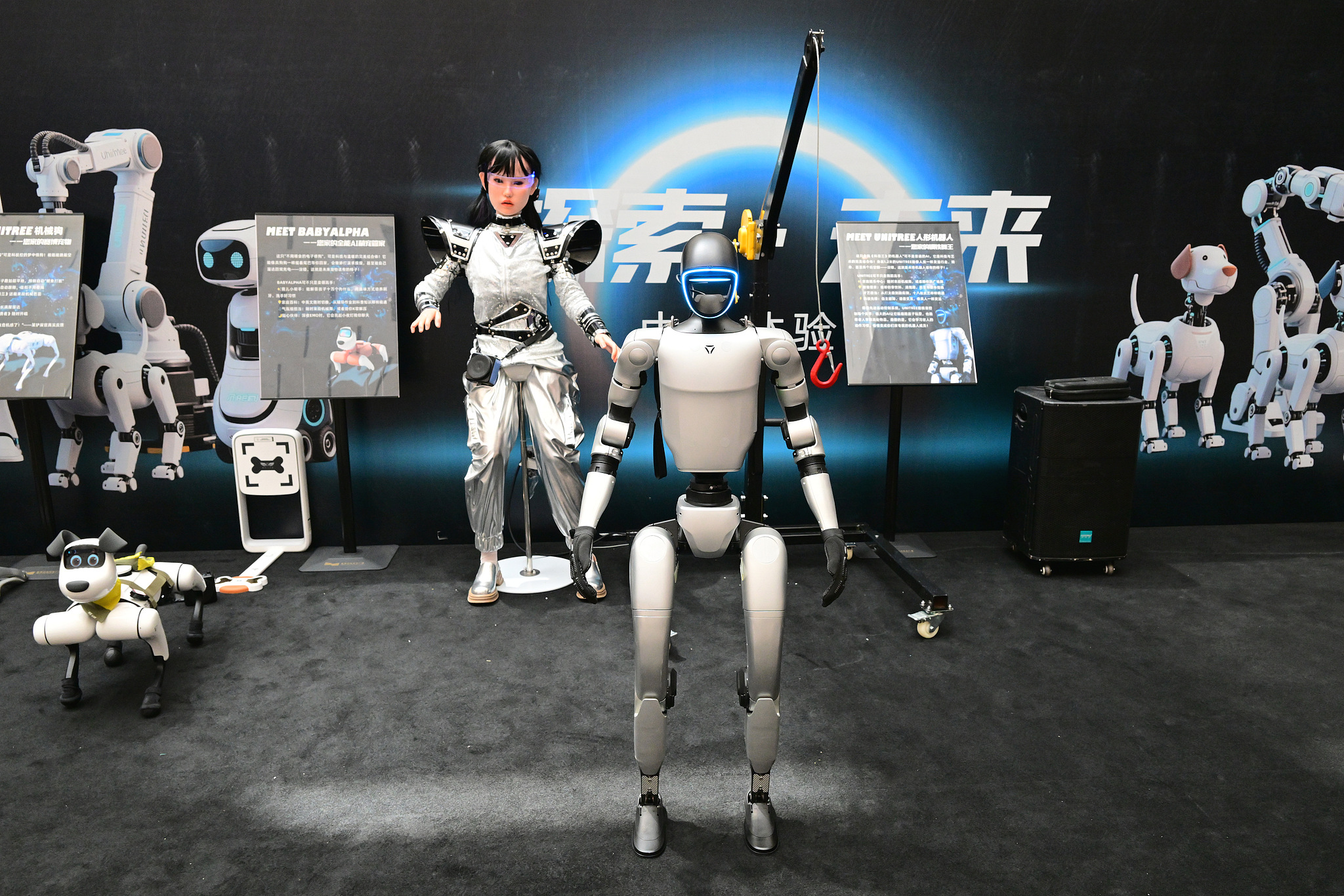 Humanoid robots and four-legged bionic robot dogs are showcased at the AI Intelligent Robot Science Exhibition in Jinhua Zhiguang Cultural Square Science and Technology Museum, Jinhua City, East China's Zhejiang Province, July 5, 2025. /CFP