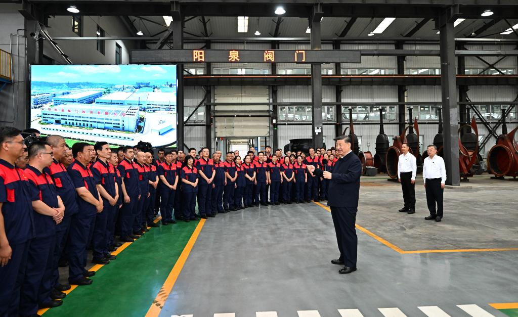 Chinese President Xi Jinping, also general secretary of the Communist Party of China Central Committee and chairman of the Central Military Commission, has a cordial conversation with workers at the Yangquan Valve Co., Ltd. in Yangquan City, north China's Shanxi Province, July 7, 2025. /Xinhua