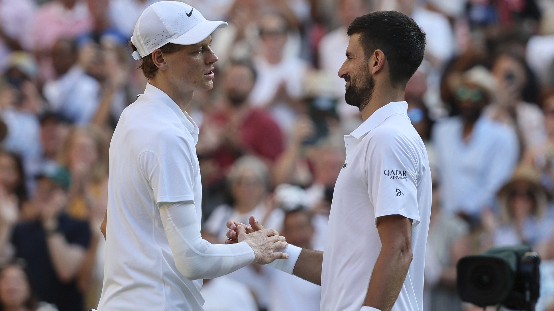 Jannik Sinner of Italy (L) and Novak Djokovic of Serbia congratulate each other on their efforts just after the men's semifinal singles match at the Wimbledon Tennis Championships in London, England, July 11, 2025. /VCG
