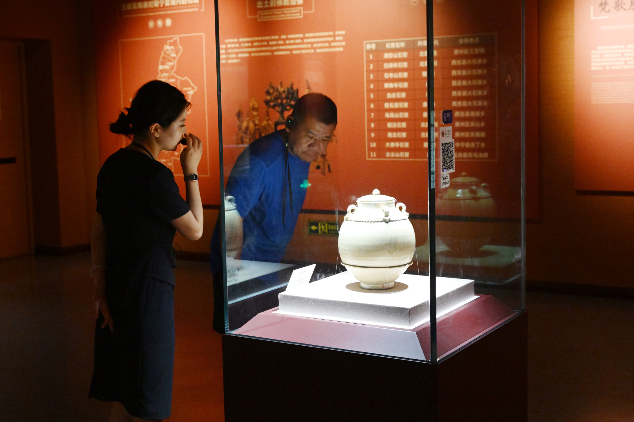 Visitors learn about the relics housed at Ningxia Museum on July 9, 2025. /VCG