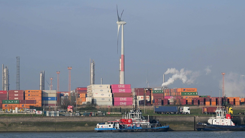 Tugboats are moored near shipping containers at the Port of Antwerp-Bruges in Antwerp, Belgium, March 24, 2025. /VCG