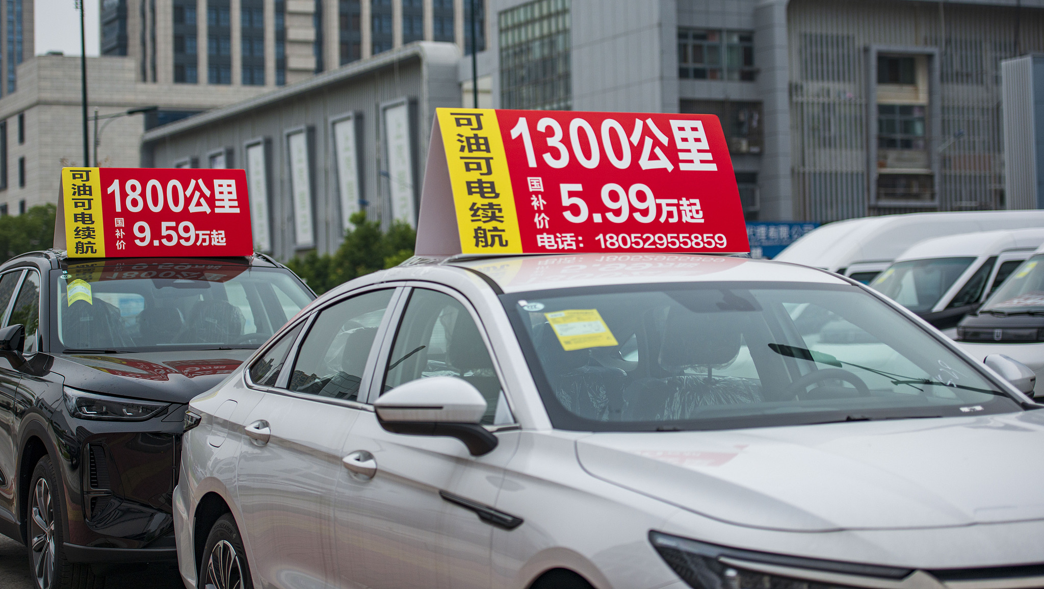 Shops selling cars and electric bikes display 