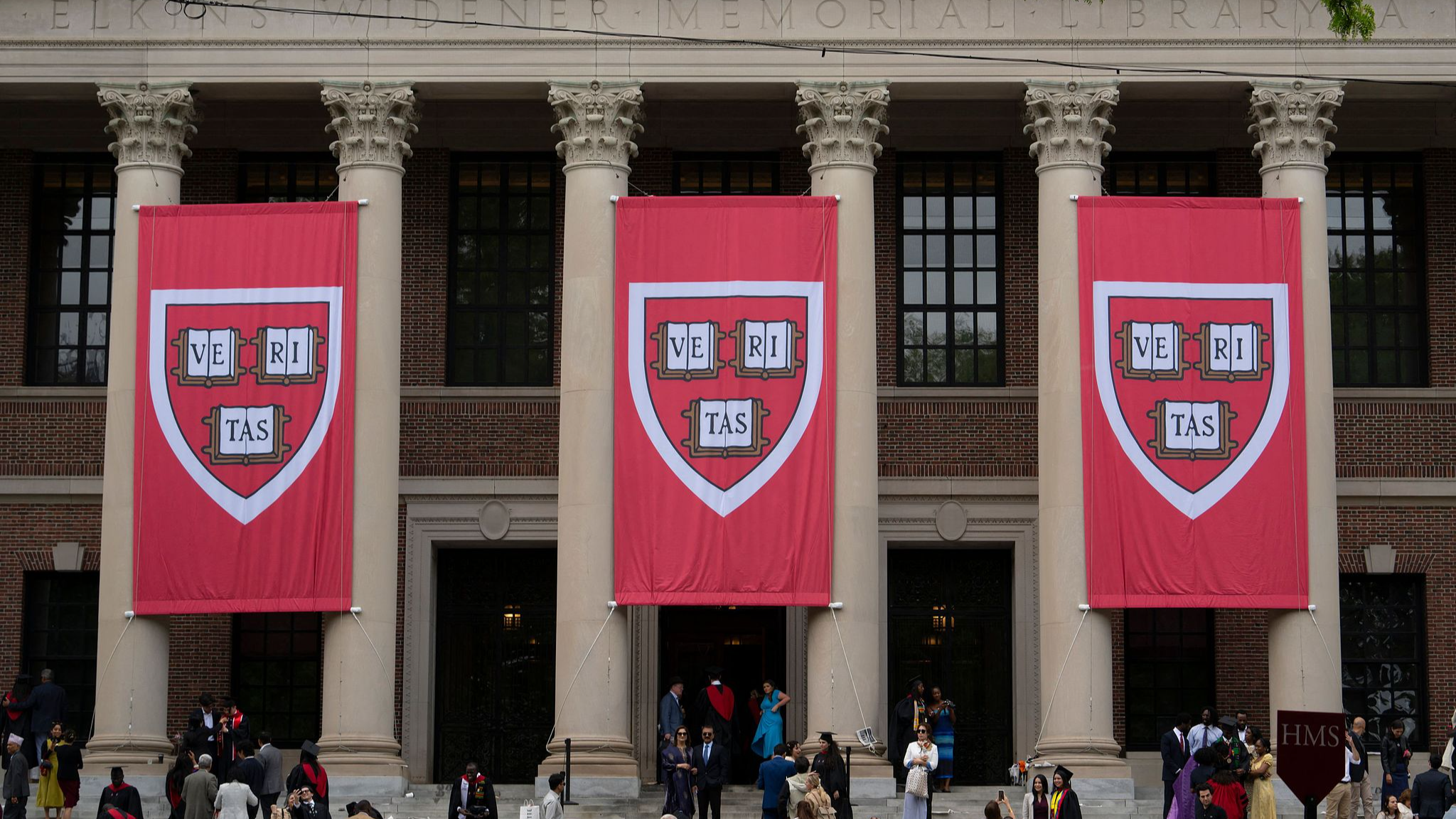 Harvard banners in front of Widener Library during the 374th Harvard Commencement in Harvard Yard in Cambridge, Massachusetts, U.S., May 29, 2025. /VCG