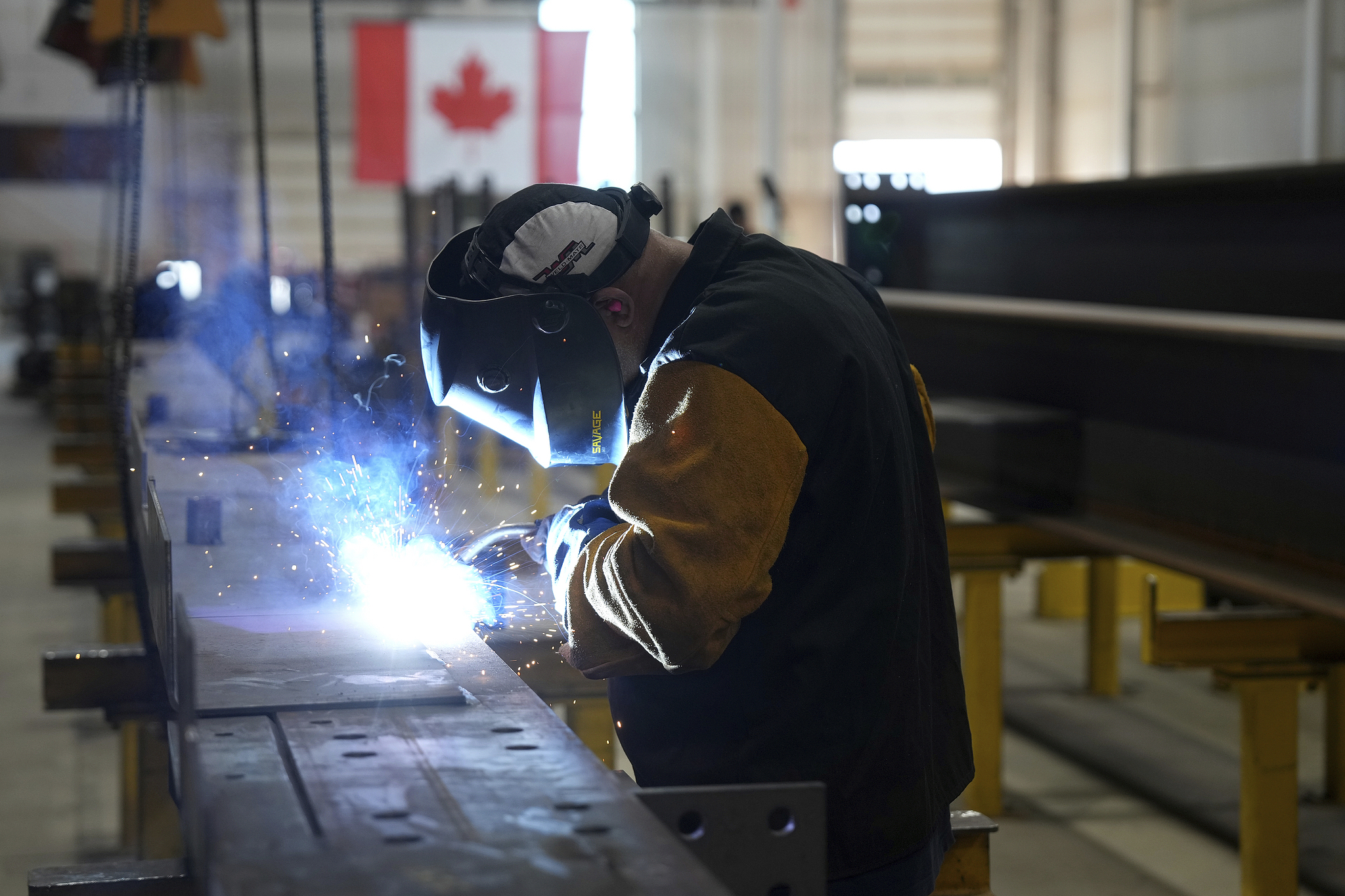 A worker was welding at a steel manufacturing facility in Hamilton, Ontario, Canada, on July 16, 2025./ VCG