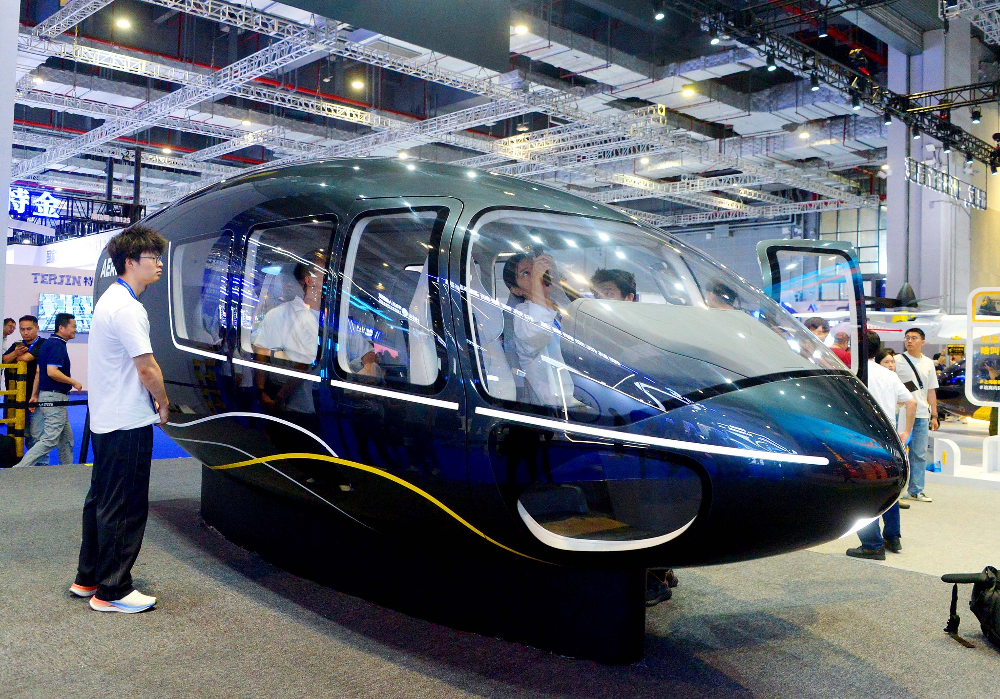 People visit the 2025 International Advanced Air Mobility Expo at the National Exhibition and Convention Center in Shanghai on July 23, 2025. /VCG