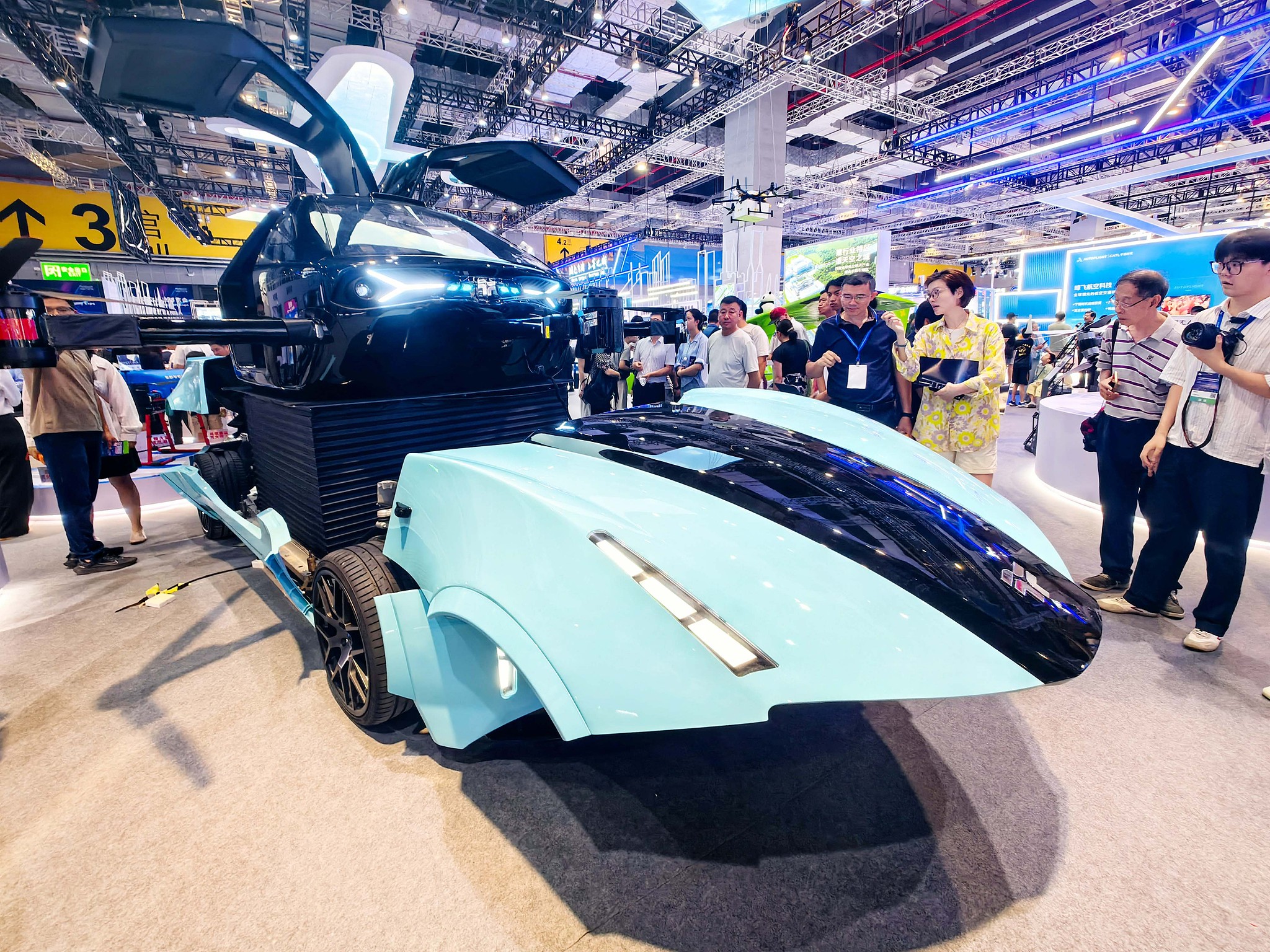 People visit the 2025 International Advanced Air Mobility Expo at the National Exhibition and Convention Center in Shanghai on July 23, 2025. /VCG