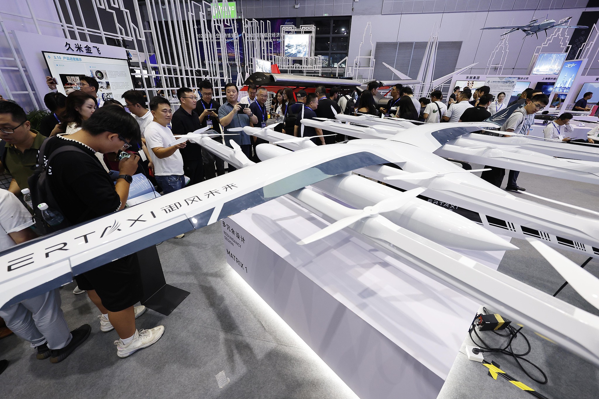 People visit the 2025 International Advanced Air Mobility Expo at the National Exhibition and Convention Center in Shanghai on July 23, 2025. /VCG