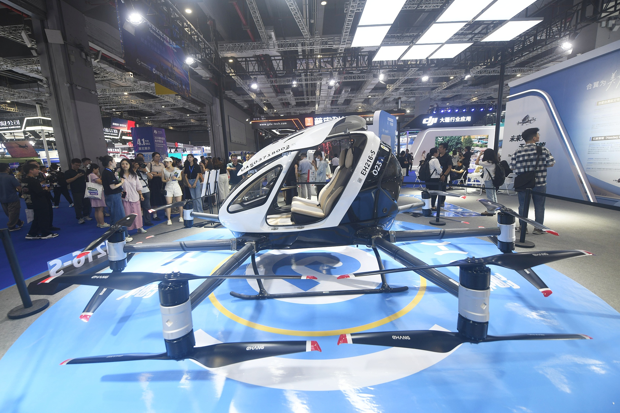 People visit the 2025 International Advanced Air Mobility Expo at the National Exhibition and Convention Center in Shanghai on July 23, 2025. /VCG
