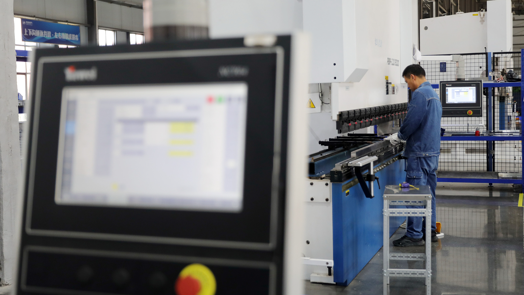 A worker assembles electrical components at a private high-tech enterprise in Huaibei, Anhui Province, China, July 15, 2025. /VCG