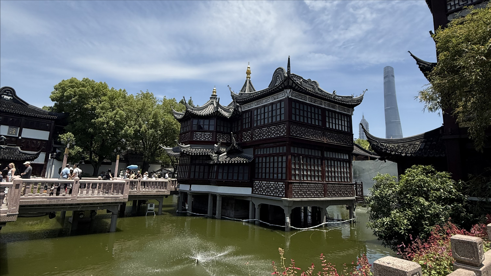 Yuyuan Market and the towering silhouettes of modern Shanghai behind it. /Zaruhi Poghosyan
