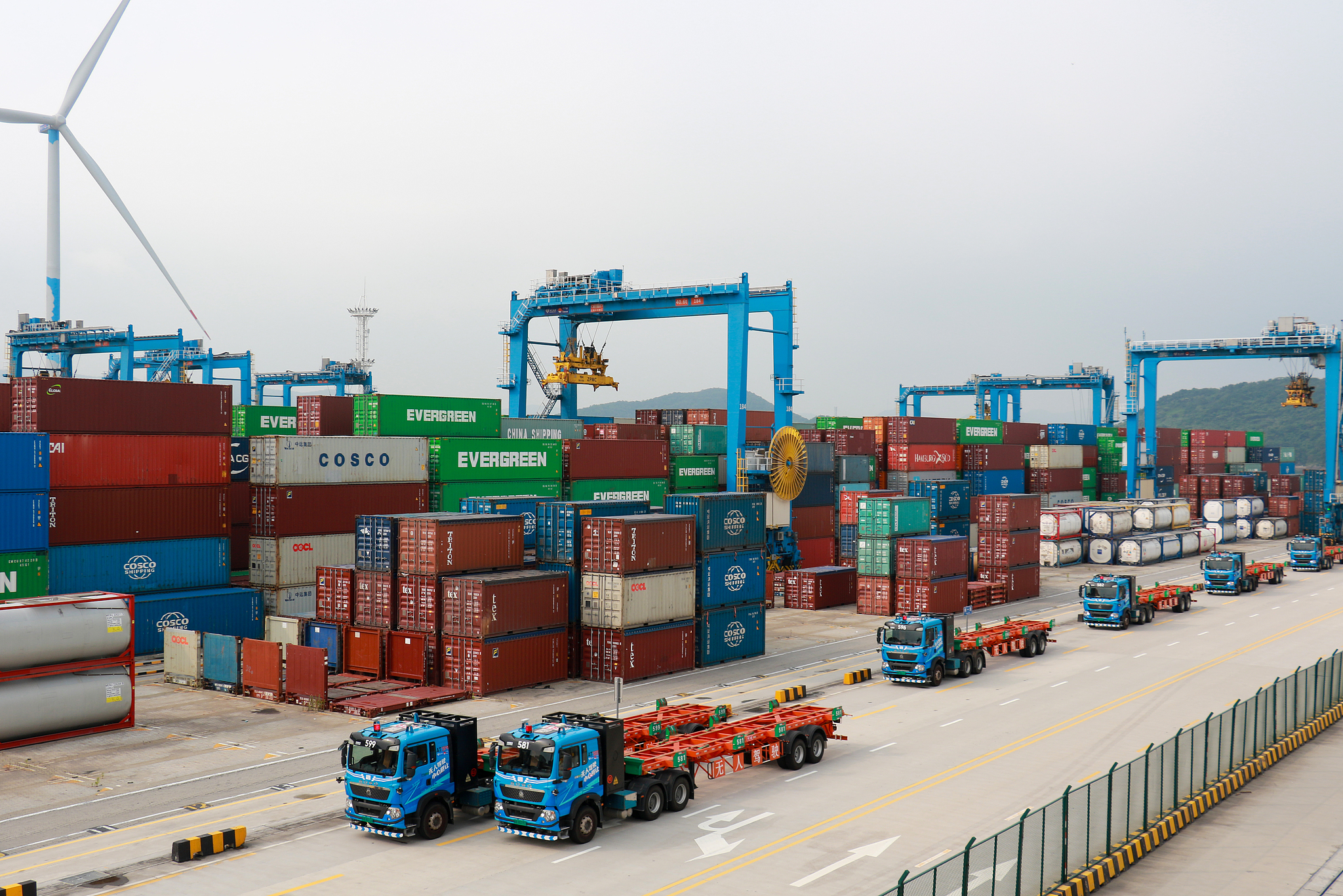 Unmanned intelligent container trucks operate at Meishan Port Area of Ningbo Zhoushan Port in Zhejiang Province, China, August 4, 2025. / VCG