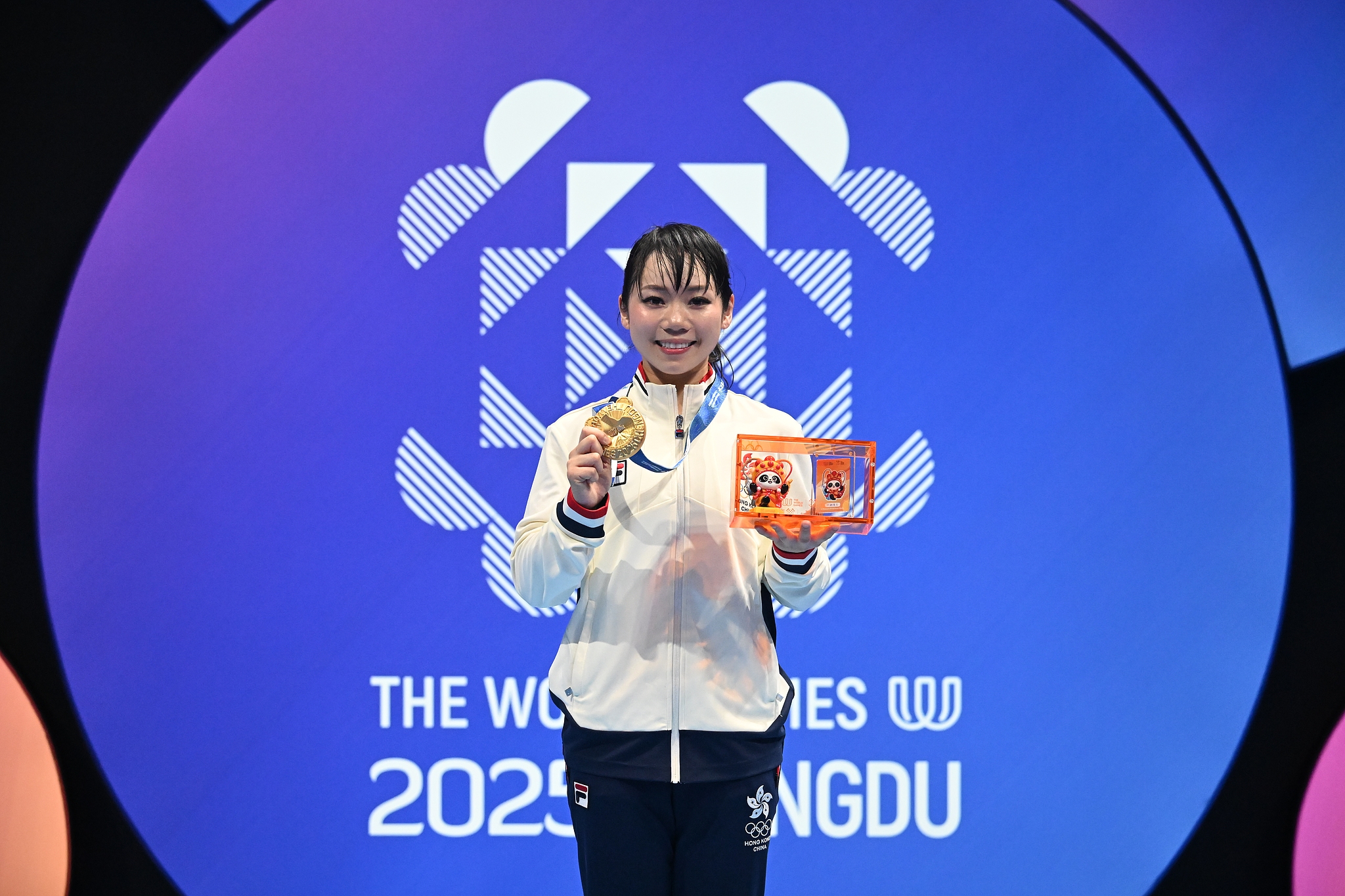 Gold medalist Lau Mo Sheung of China's Hong Kong displays her award after the karate women's kata event at the 2025 Chengdu World Games in Chengdu, southwest China's Sichuan Province, August 8, 2025. /VCG