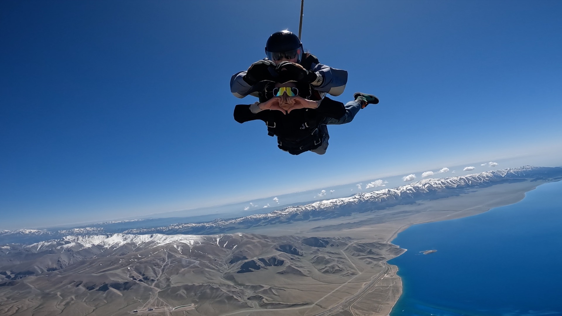 Skydiving over the lake. 