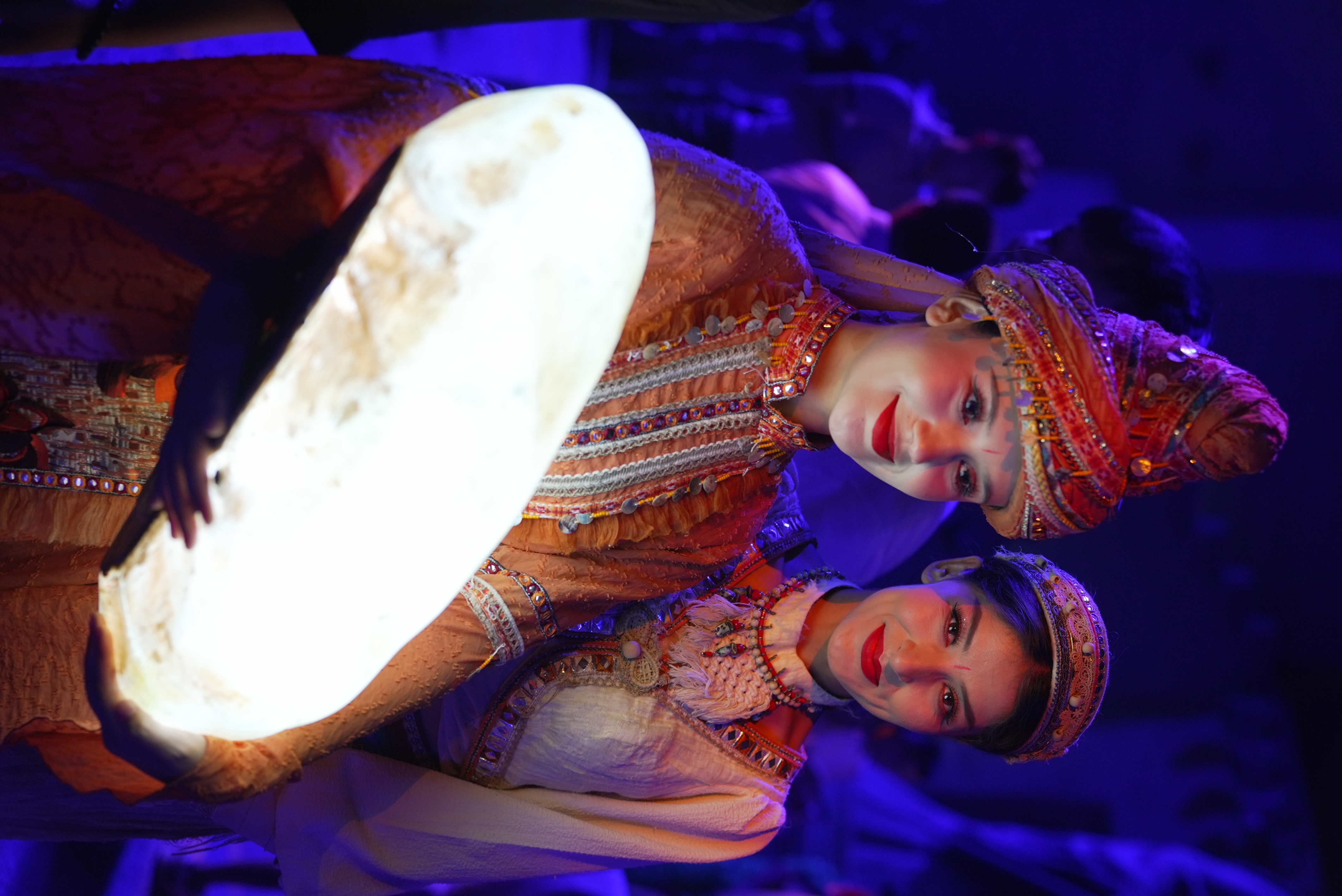 Ethnic costumes adorn the scenes of Yotkan Ancient City, each stitch and thread carrying the legacy of tradition. 