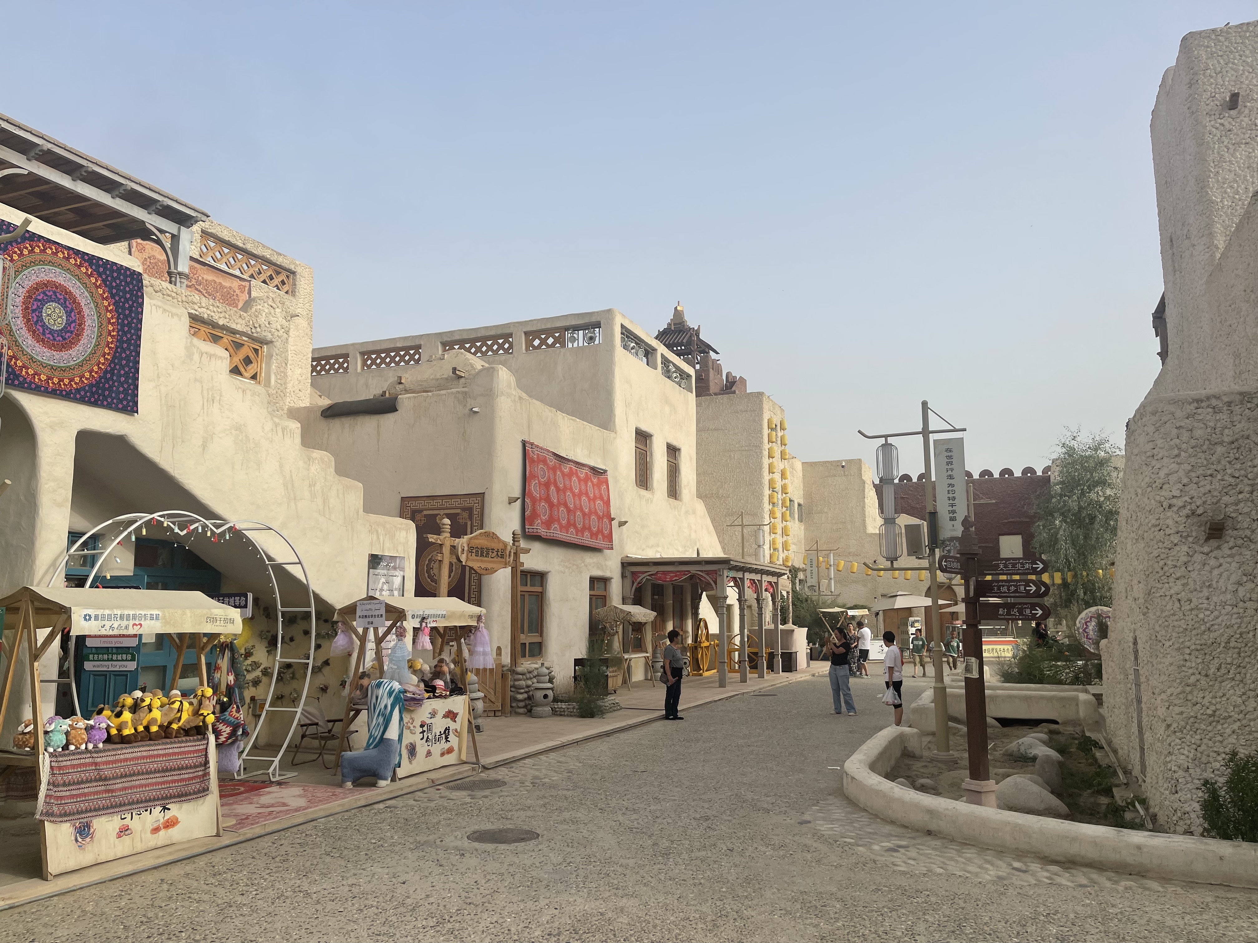 Ancient buildings, colorful tapestries, and bustling stalls fill the streets of Yotkan Ancient City with the vibrant spirit of the Western Regions. 