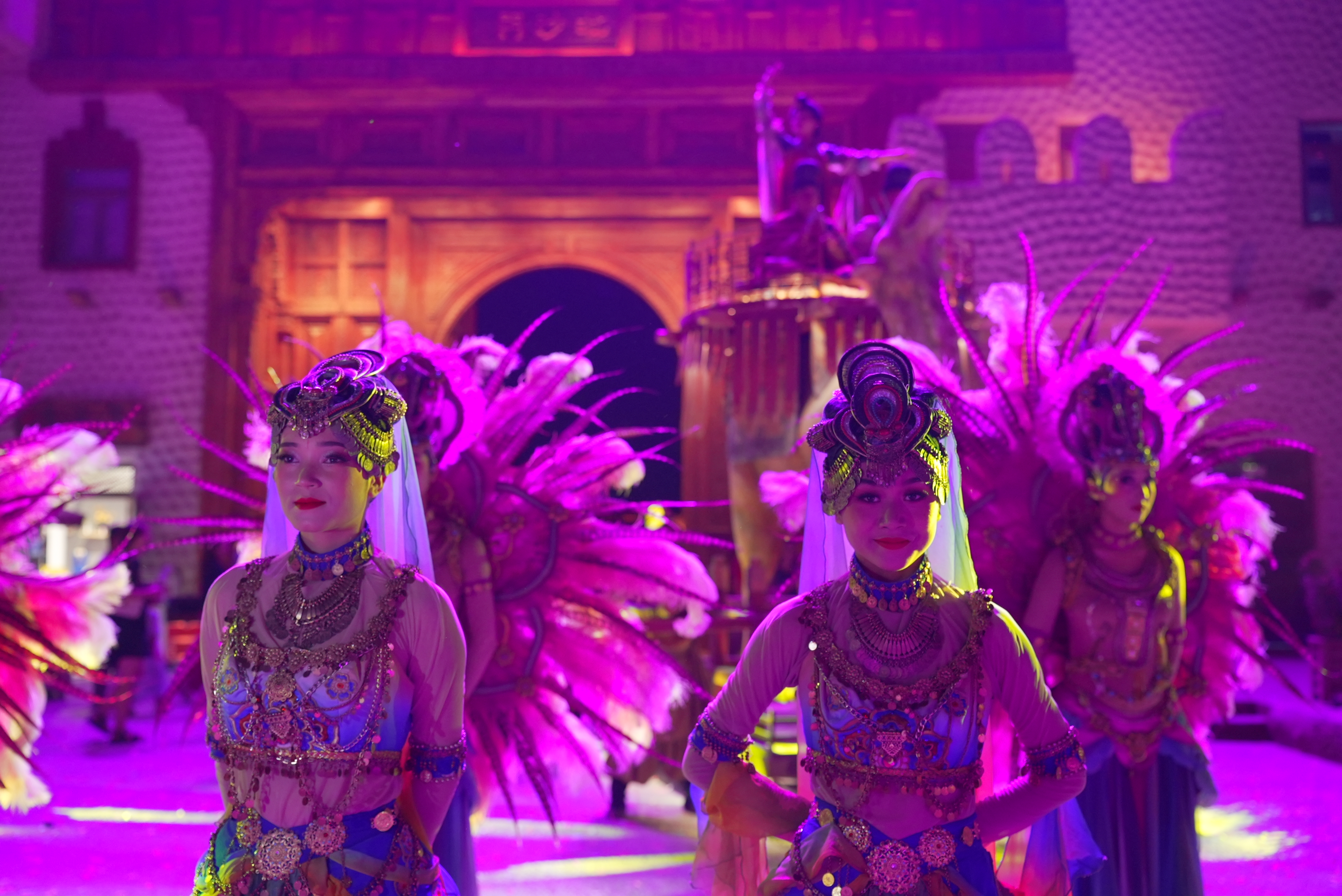 Actors in splendid ethnic costumes revive the passion and romance of the Silk Road through dazzling dances at Yotkan Ancient City,  northwest China's Xinjiang Uygur Autonomous Region. 
