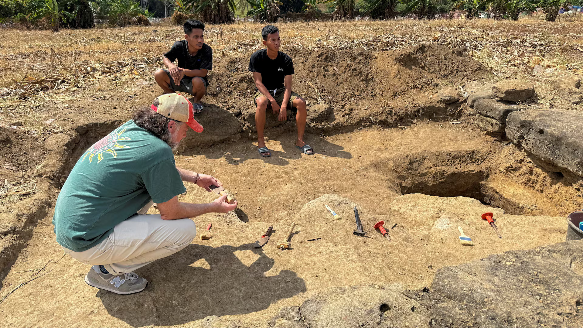 Archaeologists from Australia and Indonesia work at the site where they found small, chipped tools, used to cut little animals and carve rocks, which scientists say may be evidence of humans living there 1.5 million years ago, in Soppeng, South Sulawesi province, Indonesia, August 7, 2025. /Reuters