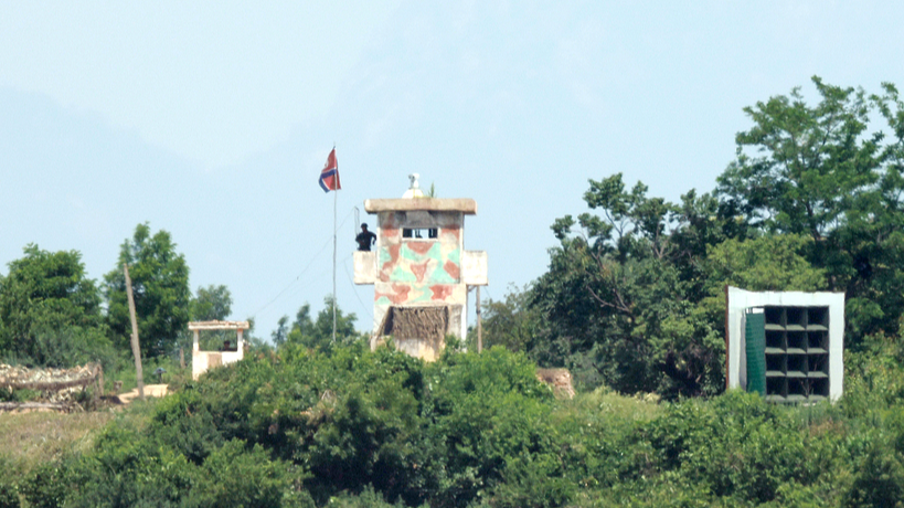 Democratic People's Republic of Korea soldiers stand guard at a checkpoint next to a loudspeaker broadcasting to South Korea, as seen from Freedom Road in Paju, Gyeonggi Province, Republic of Korea, on June 12, 2025. / CFP
