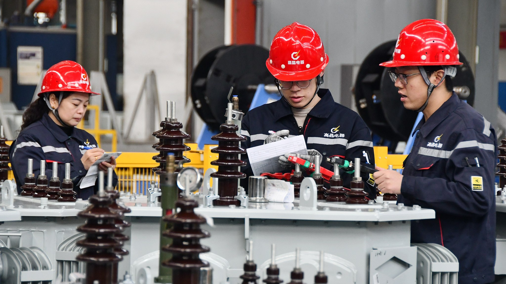 Workers test transformers at an electrical equipment company's production workshop in Handan, north China's Hebei Province, February 21, 2025. /VCG