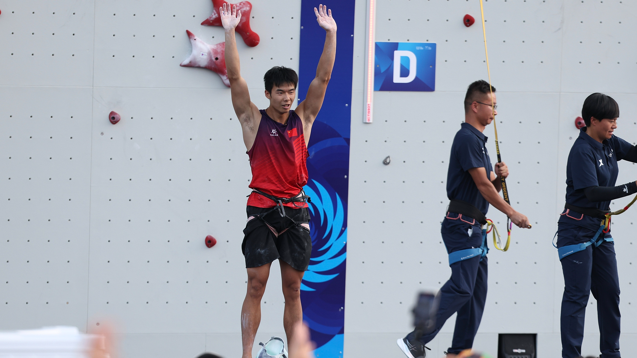 Gold medalist Long Jianguo of China reacts after winning the men's four-lane speed climbing final at the 2025 World Games in Chengdu, China, August 15, 2025. /VCG