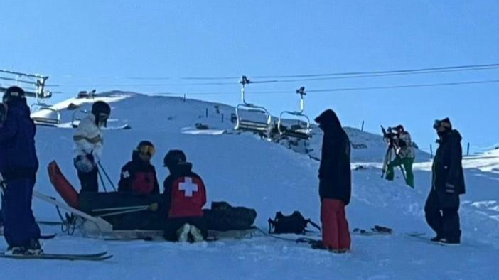 Gu Ailing of China is taken onto a stretcher in New Zealand, August 15, 2025. /Xinhua