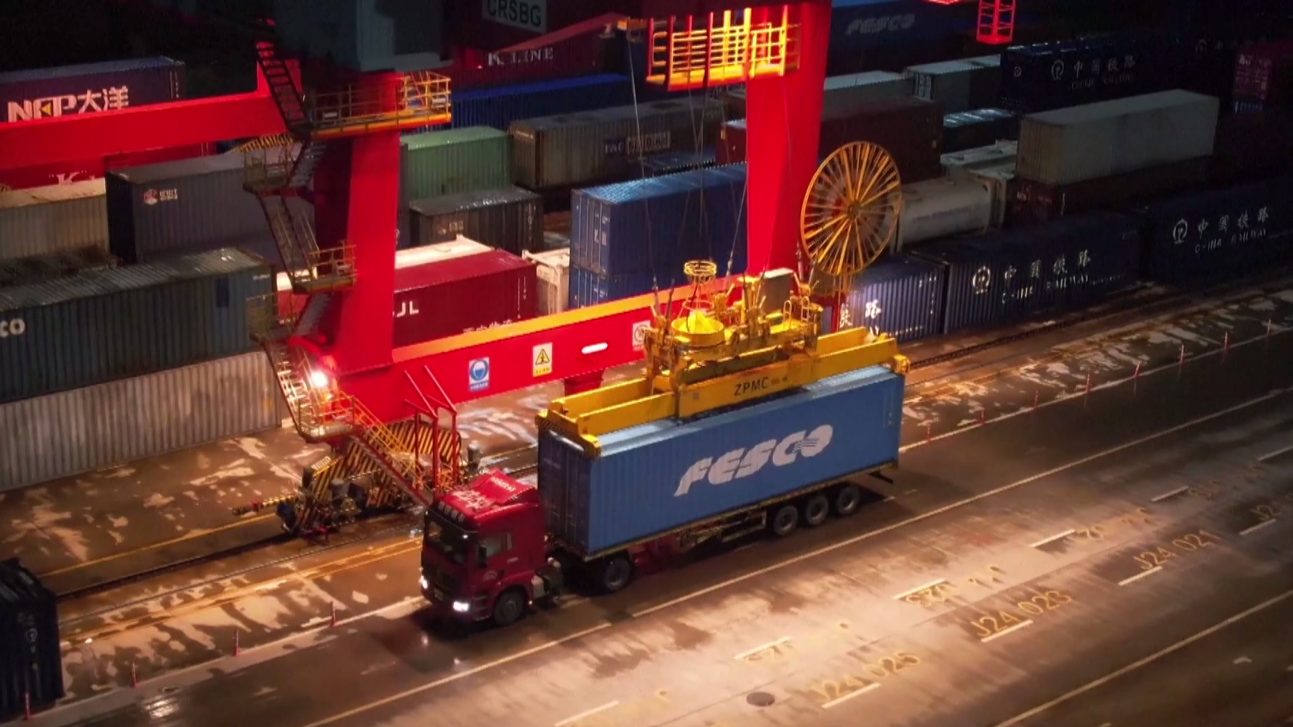 Workers carry out overnight loading operations in preparation for the departure of a China-Europe Railway Express in Shenzhen City, south China's Guangdong Province, February 1, 2024. /VCG