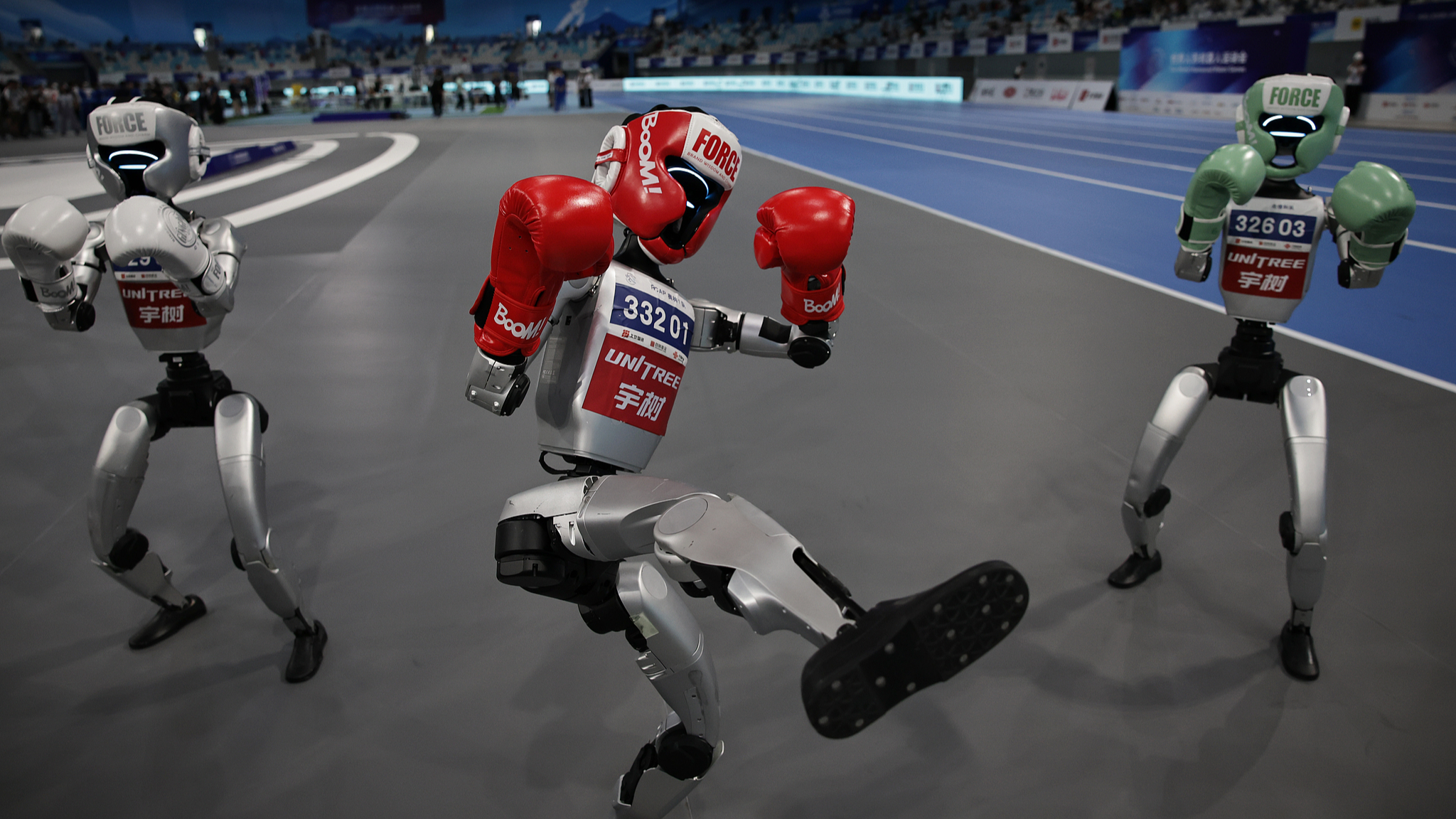 Humanoid robots showcasing skills during the 2025 World Humanoid Robot Games in Beijing, China, August 17, 2025. /VCG