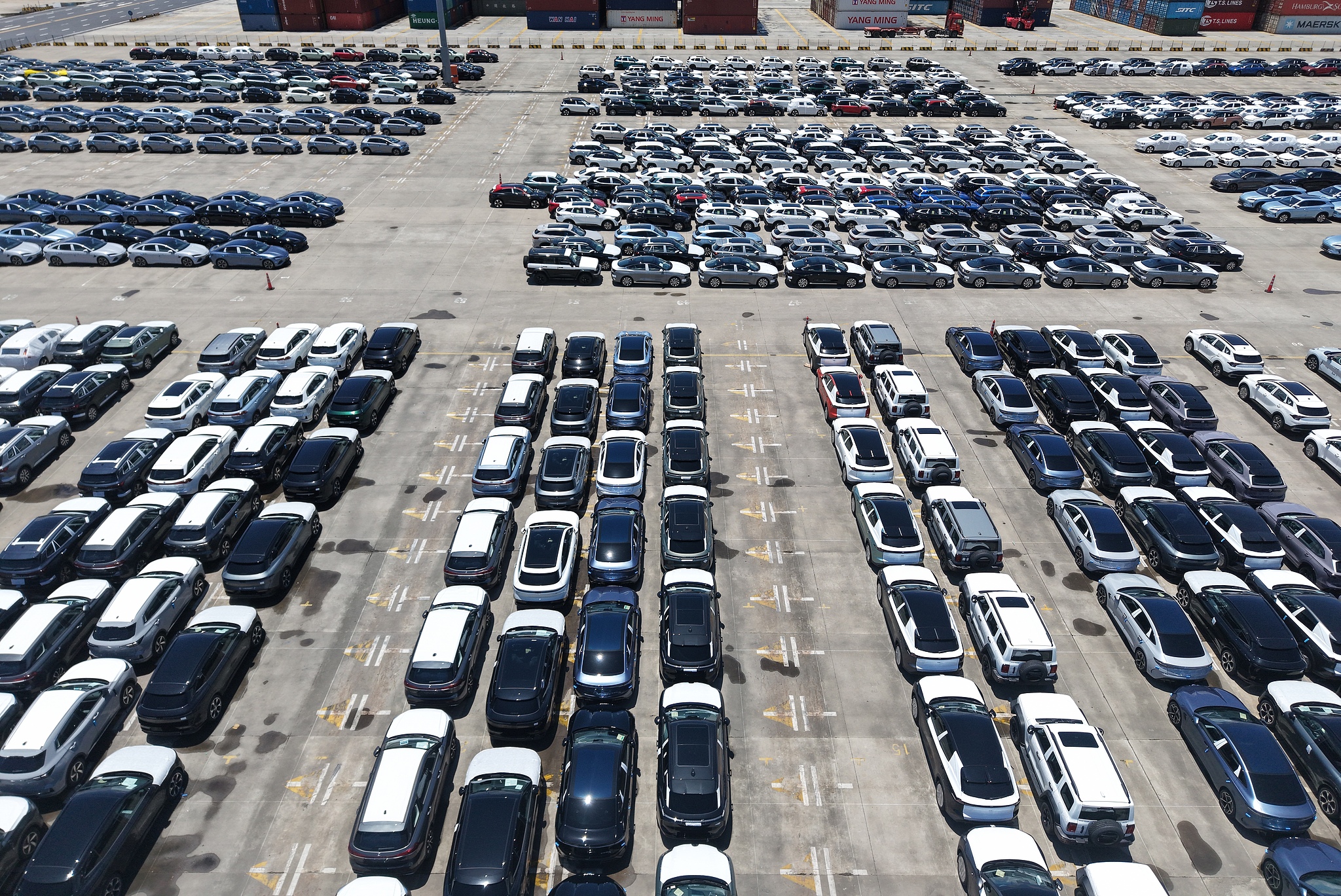 Thousands of new energy vehicles for export are parked at the dock at Shanghai Port on August 11, 2025./ VCG