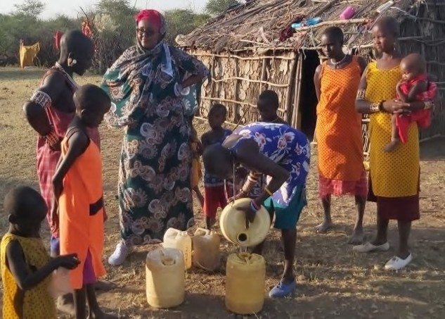 Kenyan villagers collect water. 