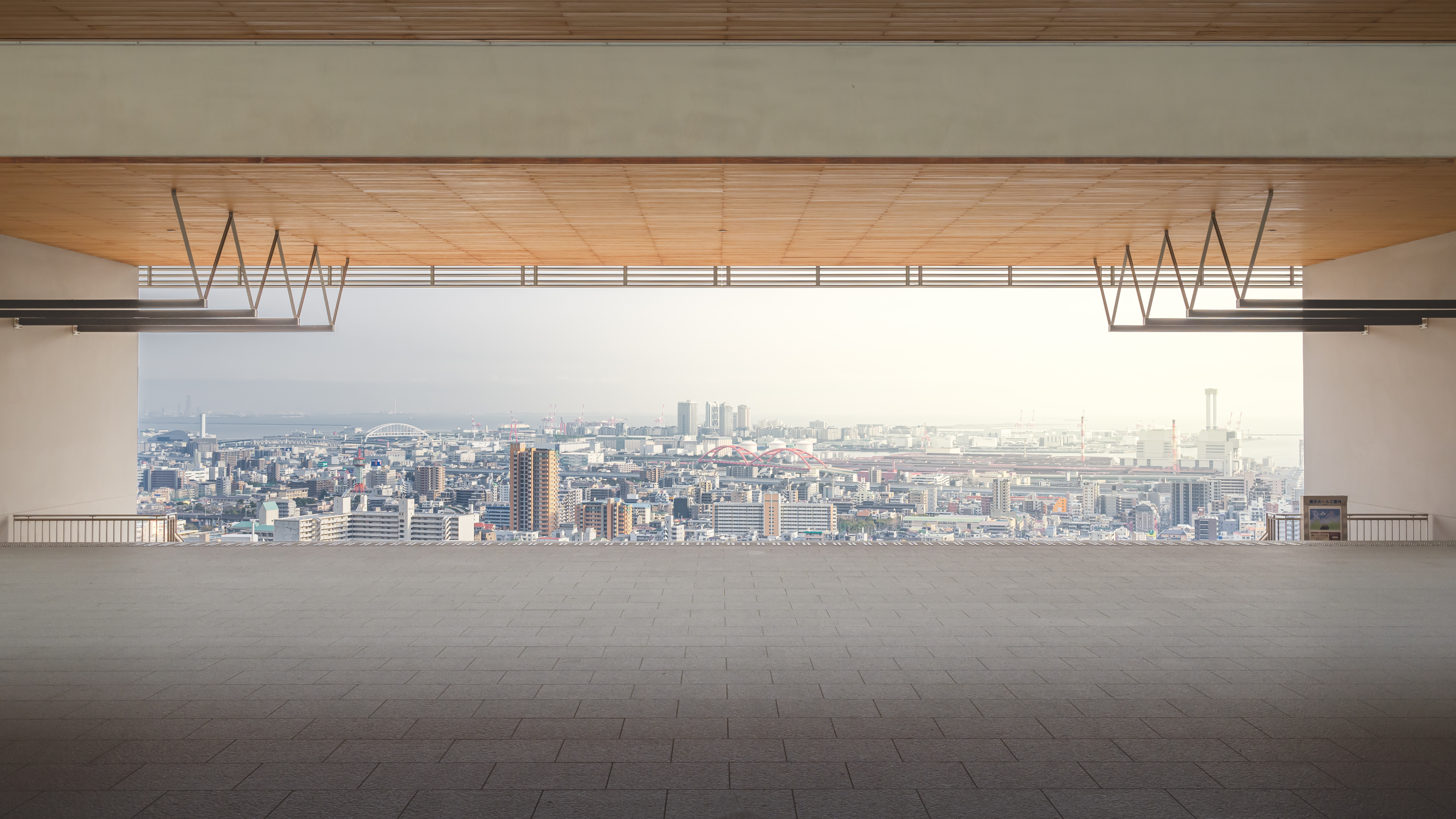 Kobe University in Japan: This is a photo taken at Kobe University in Japan, showing the urban skyline of the area where the university is located. The high-rise buildings not only demonstrate the vitality of the industry but also reflect the city's thoughtful consideration of space, resources, and the environment in innovation and development. While efficiently utilizing land and infrastructure, the concept of green and sustainable development is subtly integrated into urban planning. What the picture conveys is not only prosperity but also the wisdom of coexistence between humanity and the environment, as well as the positive force of the city's sustainable prosperity driven by innovation. /Ershiqihuasheng