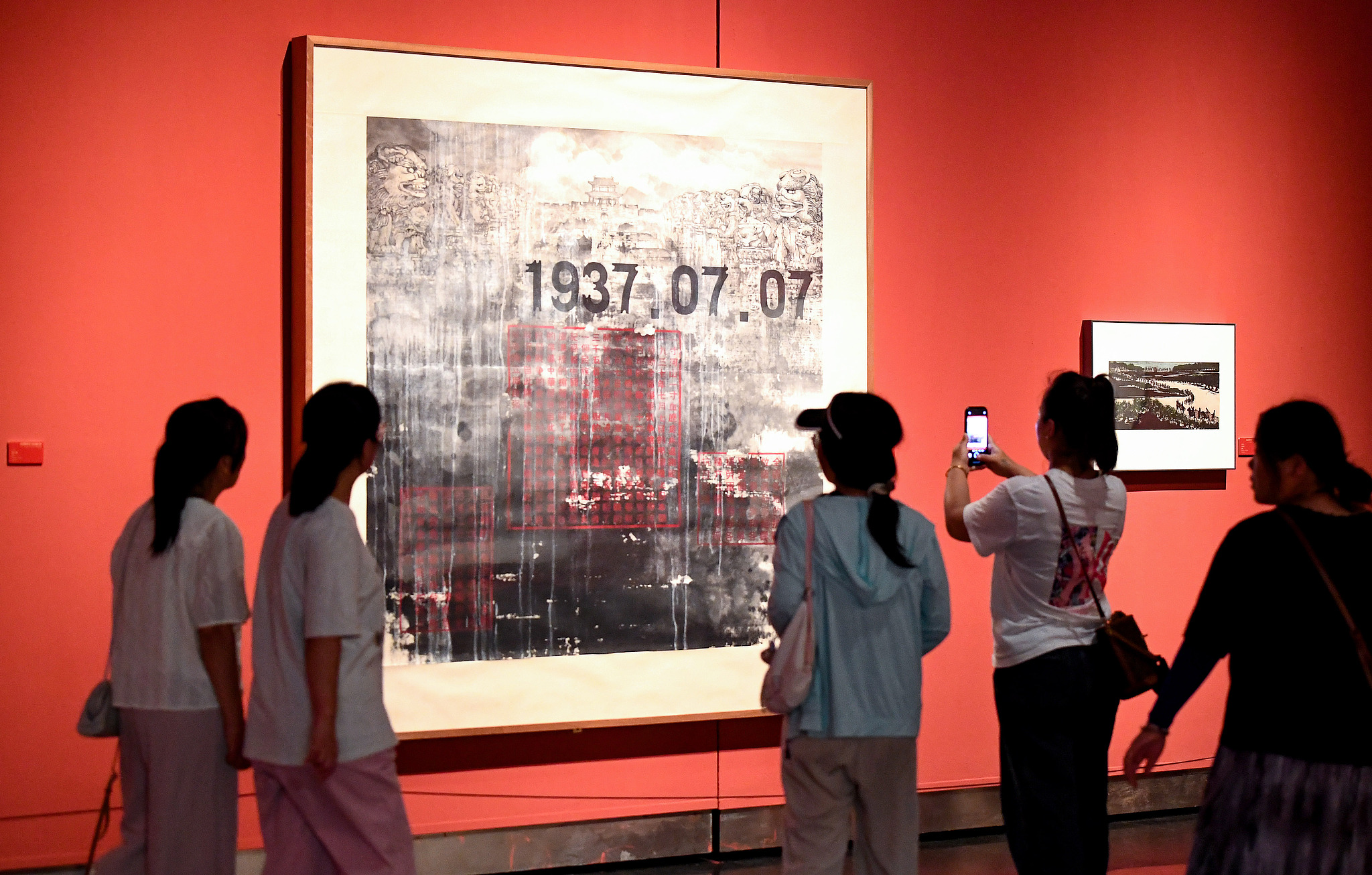 Visitors tour an exhibition of artworks commemorating the 80th anniversary of the victory of the Chinese People's War of Resistance Against Japanese Aggression in Jiangsu Art Museum, Nanjing, August 24, 2025. /CFP
