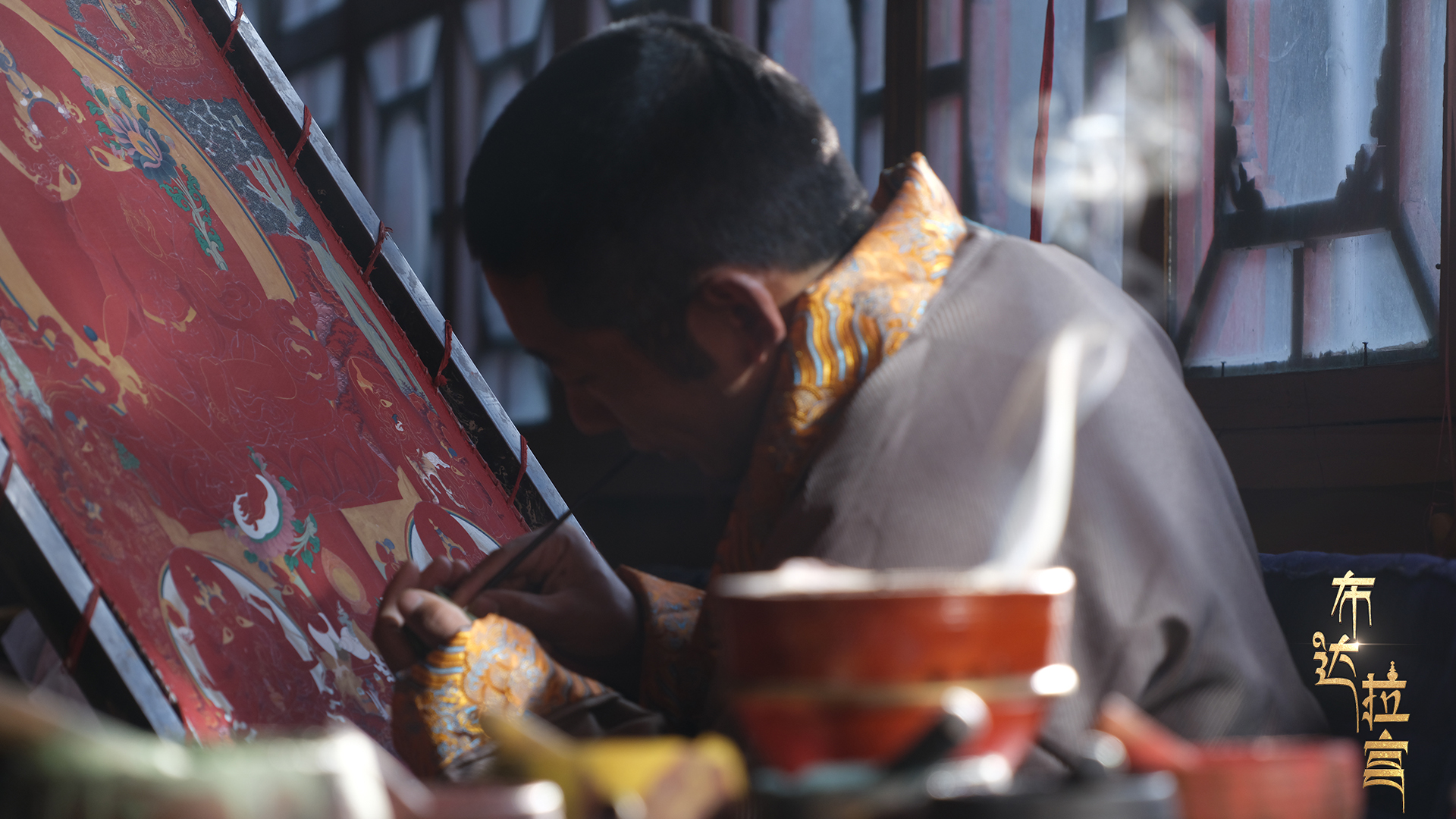 Thangka apprentice Lhachung from Sakya County, Shigatse, works on his painting, December 2, 2024. /CGTN