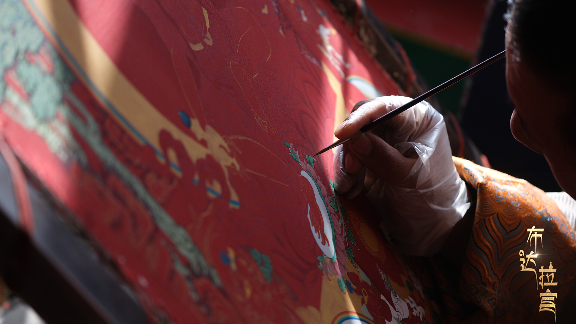 Lhachung adds final touches to his painting, December 2, 2024. /CGTN