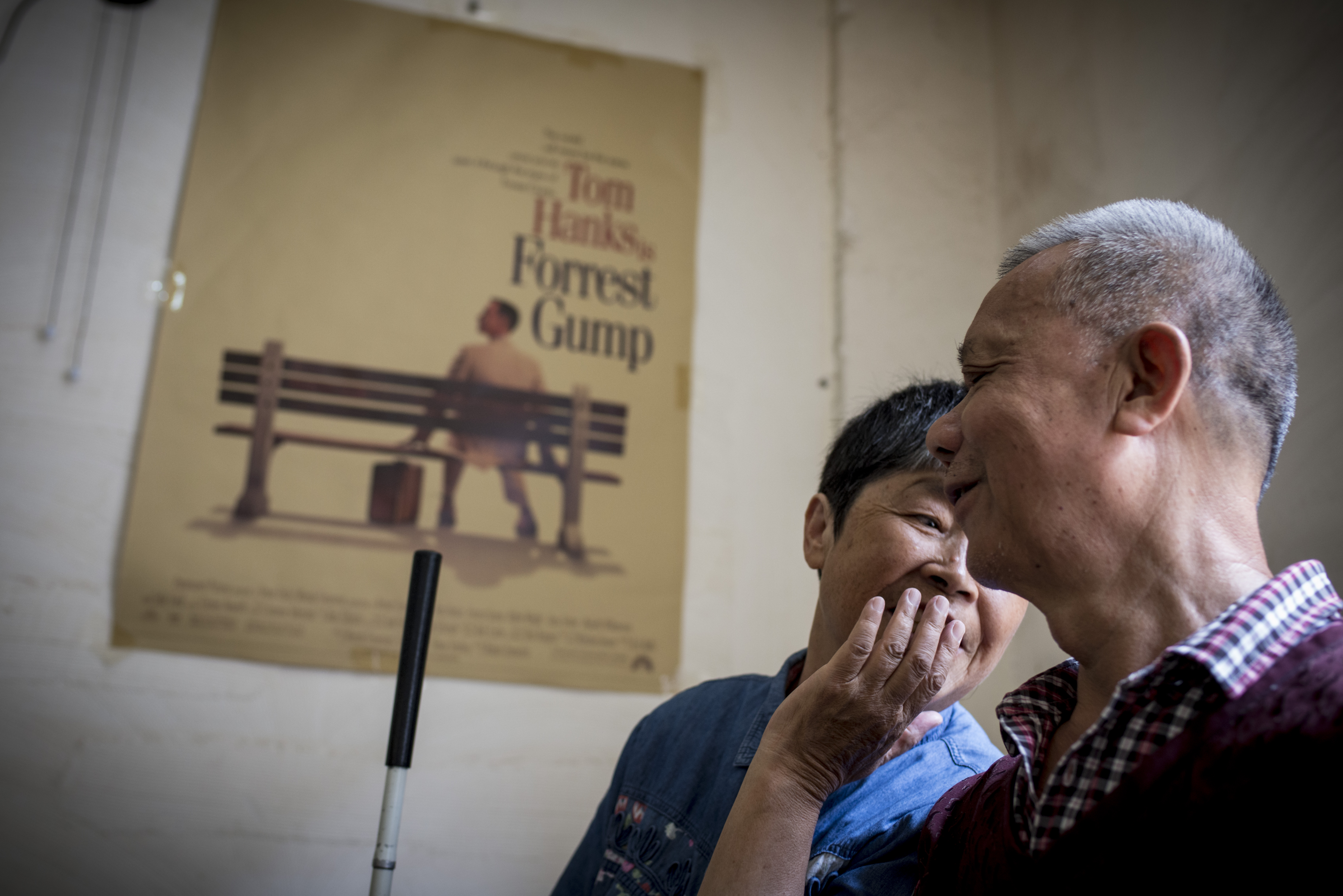 Those Who See with the Heart: This is a “cinema for the blind” located in the suburbs of Kunming that provides public services for people with visual impairments. Volunteers serving the visually impaired narrate the films in real time, following pre-prepared scripts that match the movie’s scenes. In this image, taken just before the screening begins, two visually impaired audience members are engaged in conversation. Such attentive companionship ensures that everyone can enjoy cultural resources equally and reflects a broader societal commitment to inclusion and fairness. This aligns with the United Nations Sustainable Development Goals advocating for equal opportunities and social inclusion. Through volunteer service and public initiatives, caring and shared experiences among people make society warmer, more equitable, and sustainable. /Ou Yang
