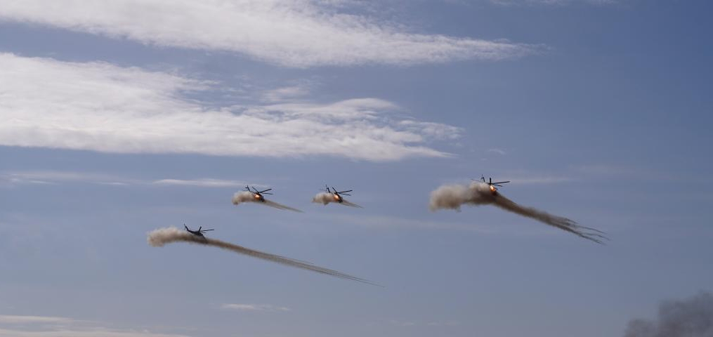 Choppers of the army aviation combat group assigned to the multinational joint forces fire rockets during the main stage drill of the SCO Peace Mission-2021 joint anti-terrorism military exercise at the Donguz training range in Orenburg Oblast, Russia, September 23, 2021. /Xinhua