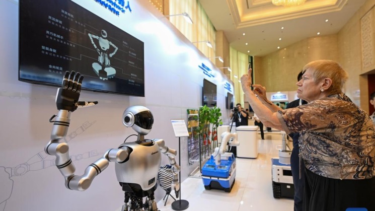 Guests visit the interactive experience zone during the 2025 Shanghai Cooperation Organization Digital Economy Forum in Tianjin, north China, July 11, 2025. /Xinhua