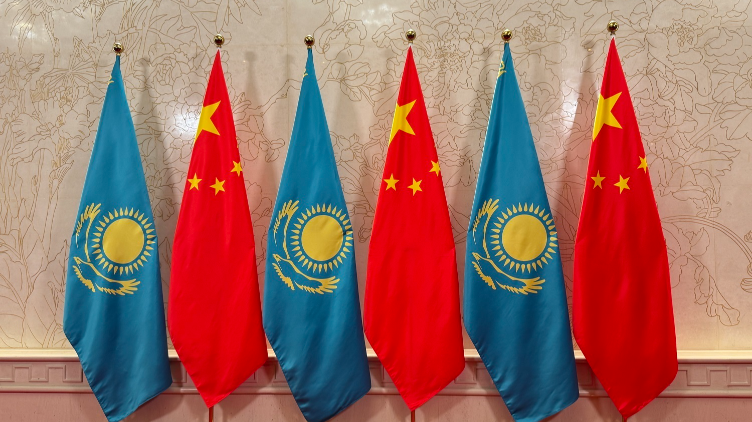 The national flags of China and Kazakhstan are displayed in a hotel, north China