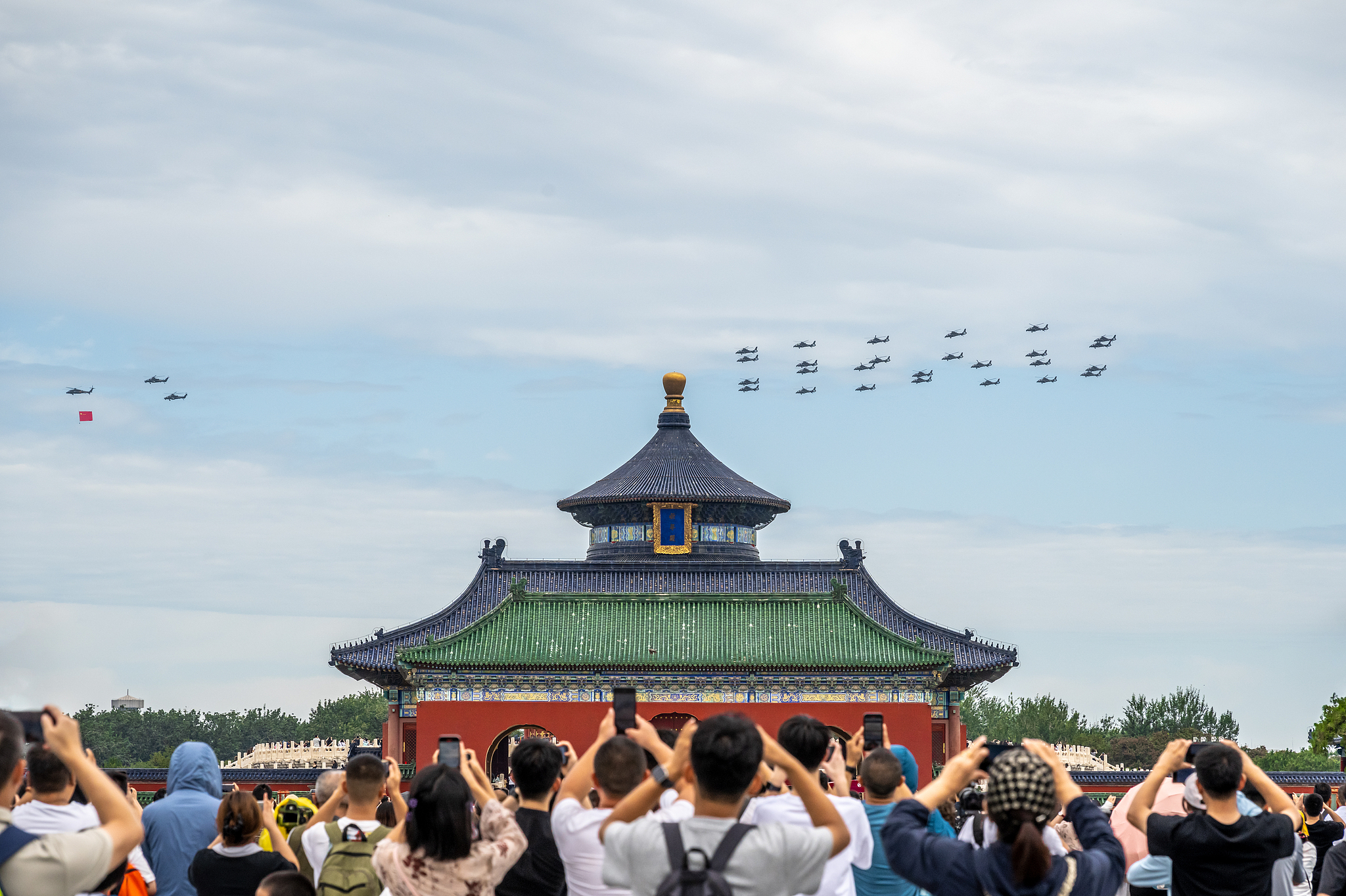 Helicopters fly over the Hall of Prayer for Good Harvests at the Temple of Heaven site during the third comprehensive rehearsal for the 80th anniversary of the victory of the Chinese People's War of Resistance Against Japanese Aggression and the World Anti-Fascist War in Beijing, August 24, 2025. /VCG