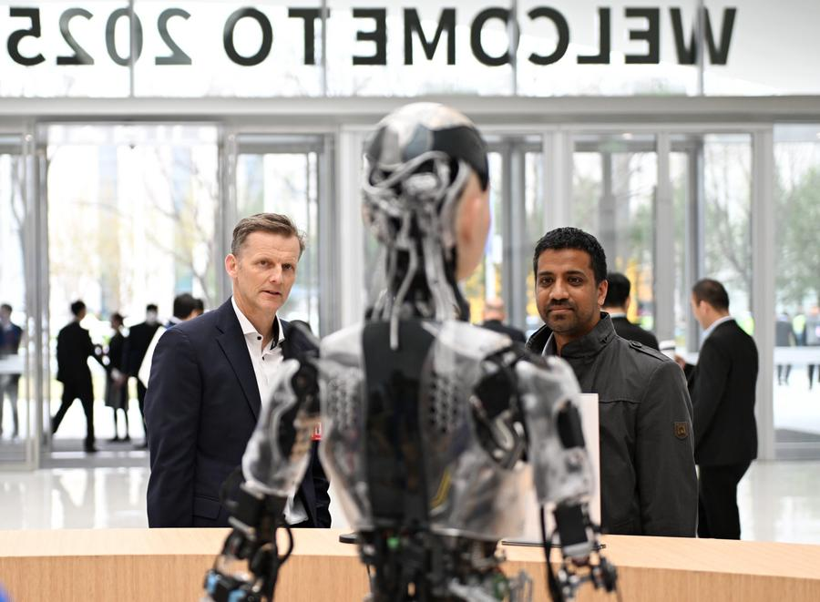 People learn about a bionic humanoid robot at the Zhongguancun International Innovation Center during the 2025 Zhongguancun Forum Annual Conference in Beijing, capital of China, March 27, 2025. /Xinhua
