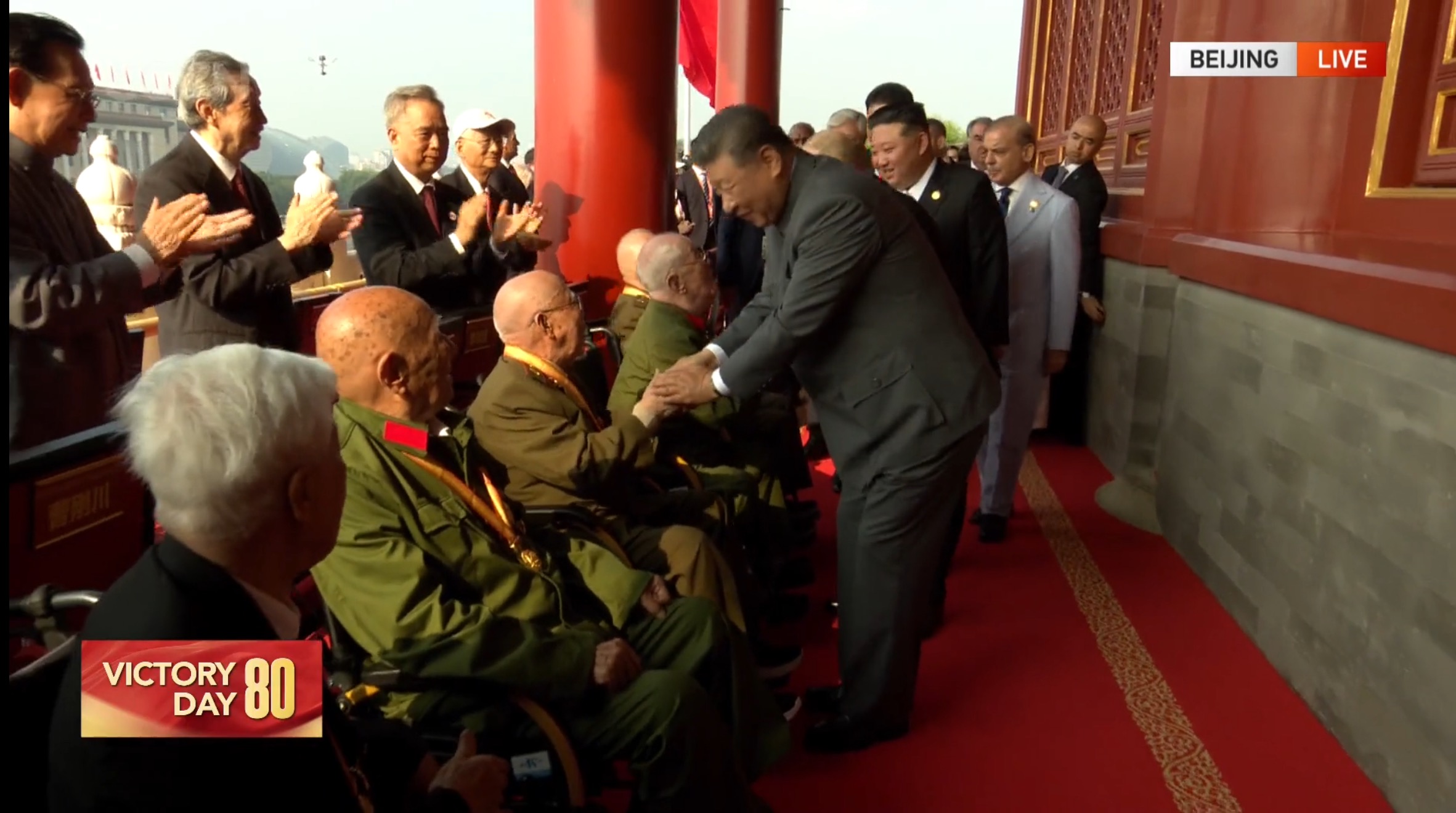 President Xi Jinping greets veterans on Tian'anmen Rostrum
