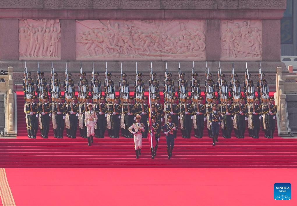 Soldiers escort the Chinese national flag for a flag-raising ceremony during a grand gathering to commemorate the 80th anniversary of the victory in the Chinese People's War of Resistance Against Japanese Aggression and the World Anti-Fascist War in Beijing, capital of China, Sept. 3, 2025. /Xinhua
