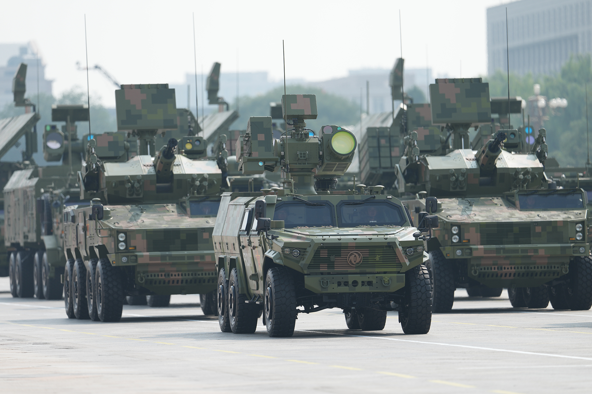Anti-drone vehicles with laser weapons on top are displayed during China's V-Day parade, September 3, 2025. /VCG